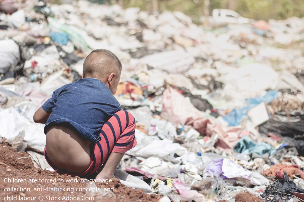 Image of young boy searching for waste